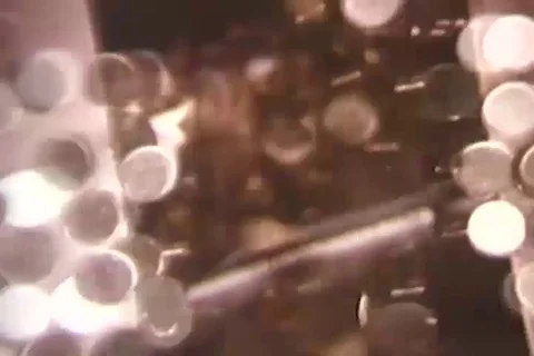 Scenes of machine double counts newly made coins - 1975 Stock Footage 99027994