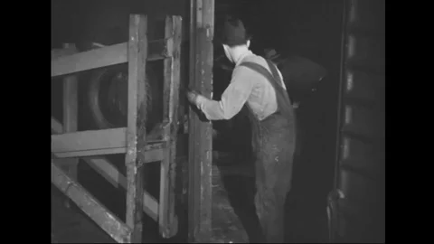 Scenes of men hang tyres and move tyres on production line of factory - 1939 Stock Footage 101983395