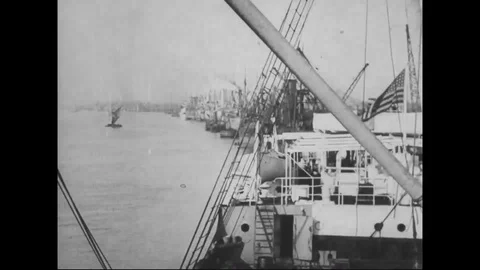 Scenes of river and ships lined along dock - 1918 Stock Footage 98950368