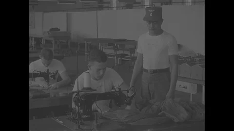 Scenes of sewing machine operation training of US Army Parachute Riggers - 1967 Video stock 118316223