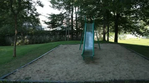 Scenes from the Suburbs - a slide in an empty playground Stock Footage 22004119