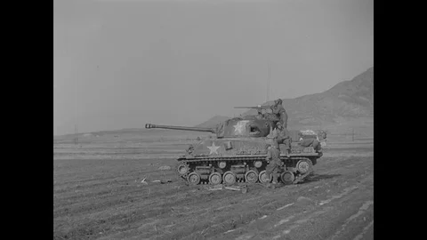 Scenes of U.S. tanks fire in field on unseen enemy Stock Footage 109494711