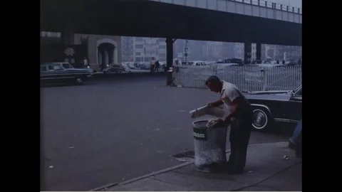 Scenes of worker collects garbage and civilians buy newspapers - 1964 Stock Footage 101726585