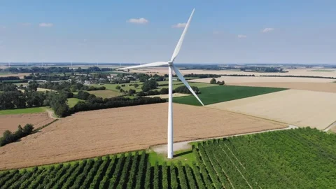 Scenic aerial drone view of wind trubines and green and yellow fields in France Stock Footage 290777539