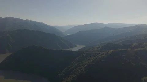 Scenic aerial flight over a river valley and mountains Stock Footage 341805851