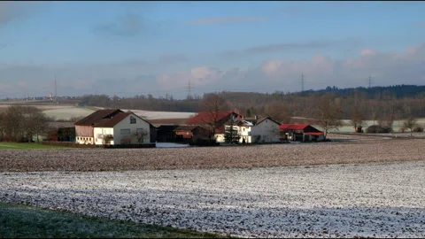 Scenic Aerial Pan Over Fields In Germany With Light Snow And Blue Sky Video Stock Footage 305192554