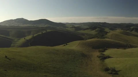 Scenic aerial panoramic view of idyllic rolling hills spring landscape in with Stock Footage 138255632