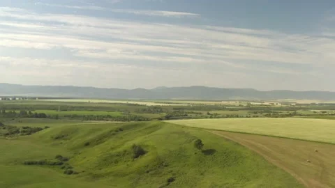 Scenic aerial panoramic view of idyllic rolling hills spring landscape in with Stock Footage 138408969