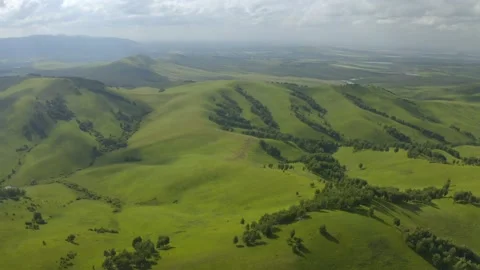Scenic aerial panoramic view of idyllic rolling hills spring landscape in with Stock Footage 138495025