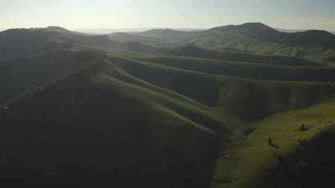 Scenic aerial panoramic view of idyllic rolling hills spring landscape in with Stock Footage 138636960