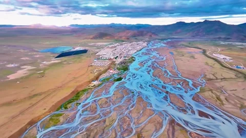 Scenic Aerial View of a Braided River, Modern City, and Solar Farm China Stock Footage 346573376