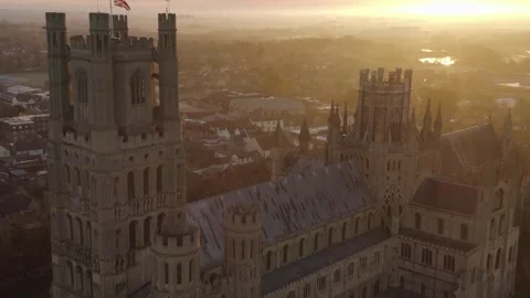 Scenic aerial view Ely cathedral tower with british flag on post beautiful Vídeos de archivo 251048695