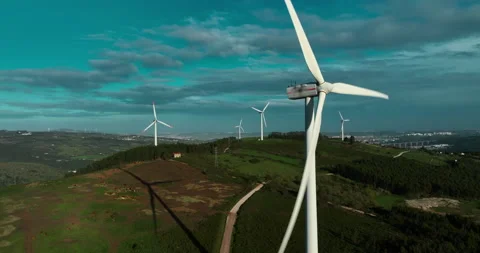 Scenic Aerial view of Large Wind Power Turbines with Blades in a Field during Stock Footage 237440043