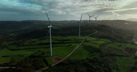 Scenic Aerial view of Large Wind Power Turbines with Blades in a Field during Stock Footage 237620867
