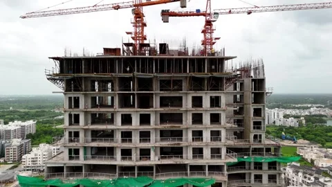 Scenic Aerial View of a Modern Construction Building Rising in a Vibrant City Stock-Footage 344021324