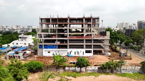 Scenic Aerial View of a Modern Construction Building Rising in a Vibrant City Stock-Footage 344021382