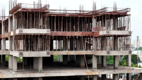 Scenic Aerial View of a Modern Construction Building Rising in a Vibrant City Stock-Footage 344021401