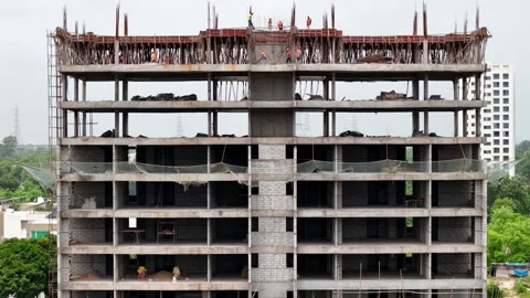 Scenic Aerial View of a Modern Construction Building Rising in a Vibrant City Stock-Footage 344021545