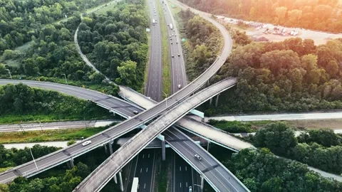 Scenic aerial view of a modern highway interchange crossing a green... Stock Footage 340657953