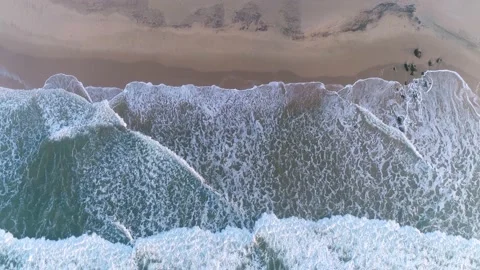 Scenic aerial view of ocean waves on a prestine sandy beach, southern Africa Stock Footage 136430474