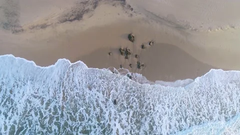 Scenic aerial view of ocean waves on a prestine sandy beach, southern Africa Stock Footage 136430779