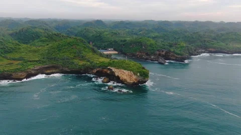 Scenic aerial view on southern Java cliffs and Ngrenehan Beach hidden in a Stock Footage 147203390