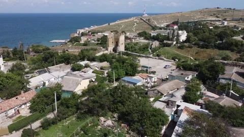 Scenic aerial view of the Tower of ancient ruined Genoese fortress Kaffa Stock Footage 163674318