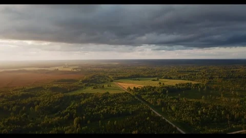 Scenic aerial views of rolling fields and moody clouds at sunset 스톡 동영상 320293402