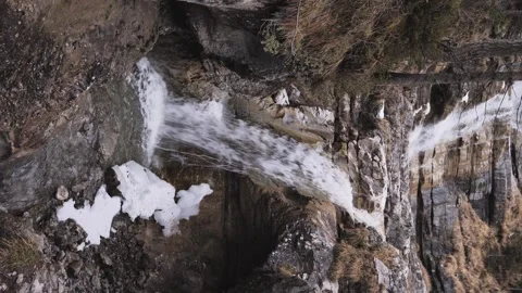 Scenic alpine waterfall flowing down a steep rock face Stock Footage 331257375