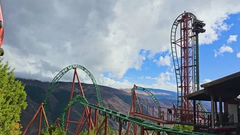 Scenic amusement park roller coaster rises above Glenwood Springs, Colorado Stock Footage 346262364