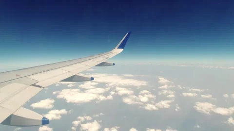 Scenic ariel view of clouds and wings of aircraft from the window Stock Footage 282995547