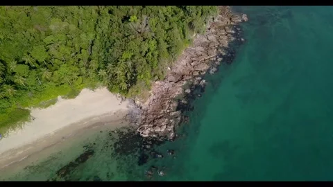 Scenic beach view with clear water and lush greenery Stock Footage 320293352