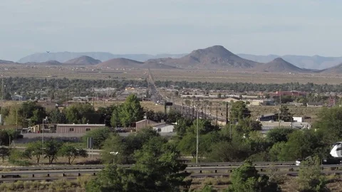 Scenic bird's eye view of Kingman AZ with Interstate 40 traffic and Bank Street Stock Footage