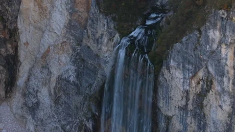 Scenic Boka waterfall flowing down a rocky cliff in Slovenia Stock Footage 323396667