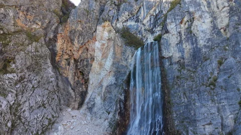Scenic Boka waterfall flowing down a rocky cliff in Slovenia Stock Footage 323396699