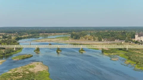 A scenic bridge spanning the Loire River in Sully-sur-Loire, France, aerial view Stock Footage 346720909