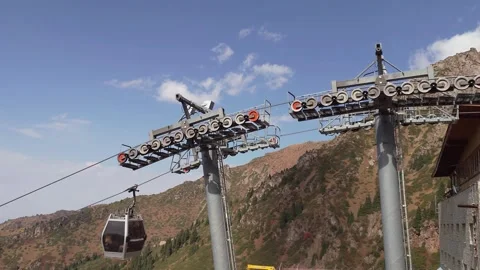 Scenic cable car system in motion, showcasing the ascent through mountainous Video stock 317219241