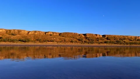 Scenic Clay Cliffs and Calm Salt Estuary Stockbeeldmateriaal 344818986