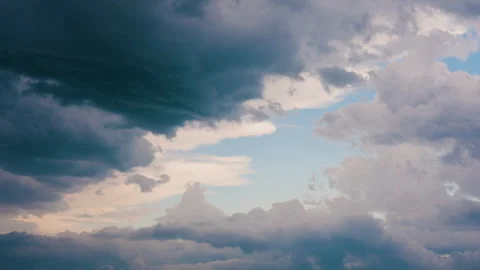 Scenic clouds drifting across sky in seamless looping background Stock Footage 345616218