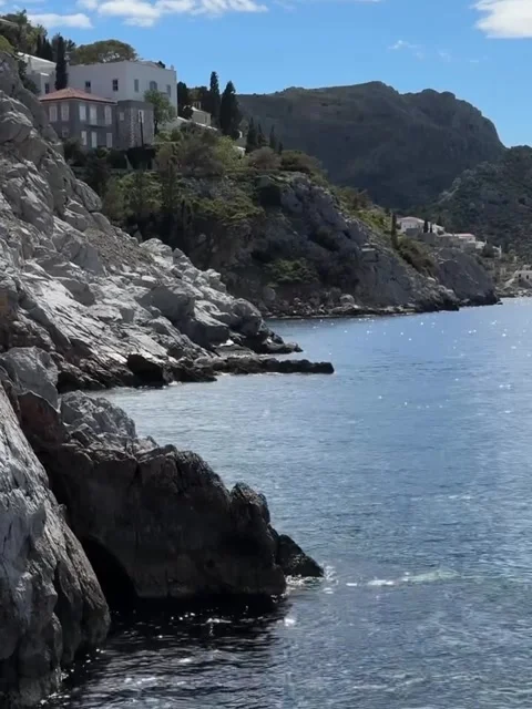 Scenic Coastal Cliffs and Blue Sea with Sunlight Reflections Stock-Footage 340263938