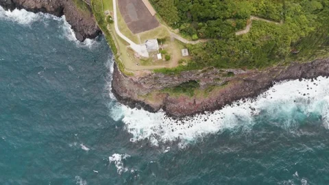 Scenic Coastal Cliffs Overlooking the Blue Ocean – Aerial View Stock Footage 336966040