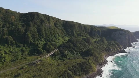 Scenic Coastal Cliffs Overlooking the Blue Ocean – Aerial View Stock Footage 336967067