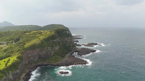 Scenic Coastal Cliffs Overlooking the Blue Ocean – Aerial View Stock Footage 336971277