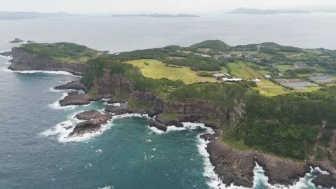 Scenic Coastal Cliffs Overlooking the Blue Ocean – Aerial View Stock Footage 336971421