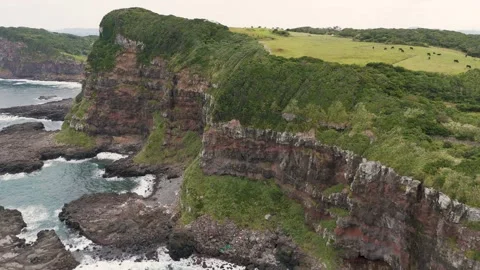Scenic Coastal Cliffs Overlooking the Blue Ocean – Aerial View Stock Footage 336971752