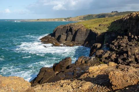 Scenic Coastal Cliffs with Waves Stock Photos