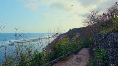 Scenic Coastal Path with Paragliders Stock Footage 293311705