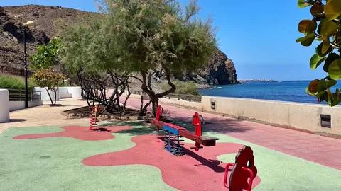 A scenic coastal playground that features vibrant colors and provides relaxing Stock Photos