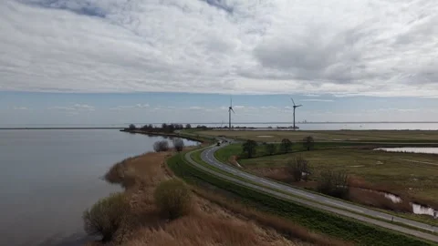 Scenic Coastal Road and Wind Turbines Near Marken - aerial drone video Stock Footage 331963512