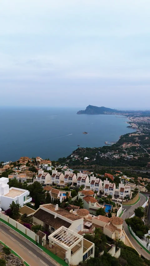 Scenic coastal view transitions from elevated perspective to closer shoreline Stock Footage 329277745